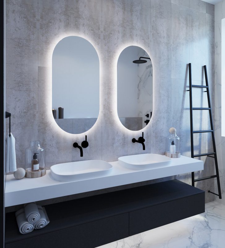 Back-Lit LED Oval Bathroom Mirrors Hanging on Wall in Bathroom