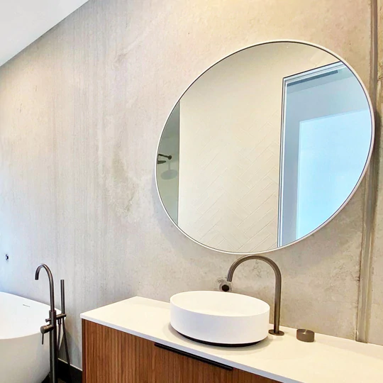 Round Bathroom Mirror above timber vanity unit