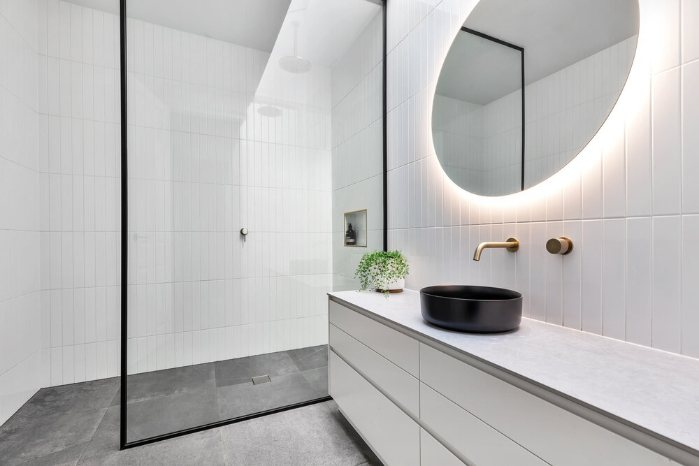 Backlit LED Round Bathroom Mirror on White Bathroom Wall
