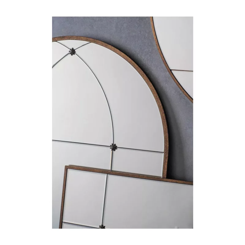 Antique Gold-Framed Arch mirror with a Window Pane Design leaned against a wall