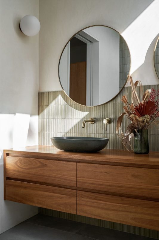 In Photo: Round Gold Brass Metal Frame Bathroom Mirror from Las Palmas by Davis Architects via thelocalproject.com.au